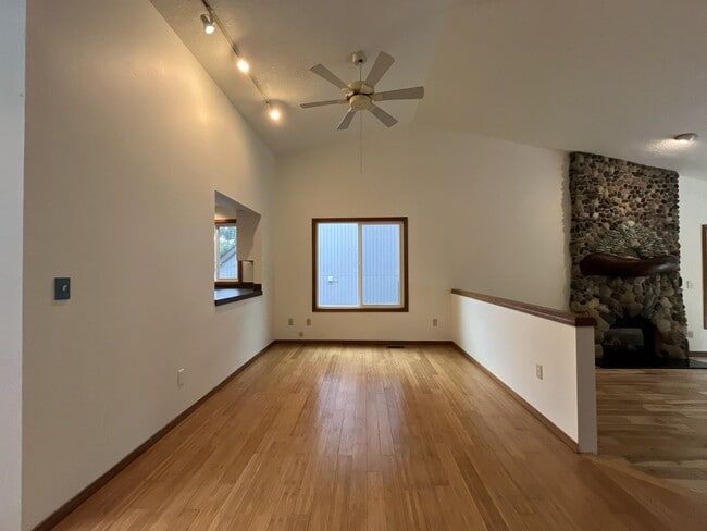 Building Photo - Spacious 3-Bedroom Home with Custom Stone Fireplace, Attached 2-Car Garage & Expansive Backyard i...
