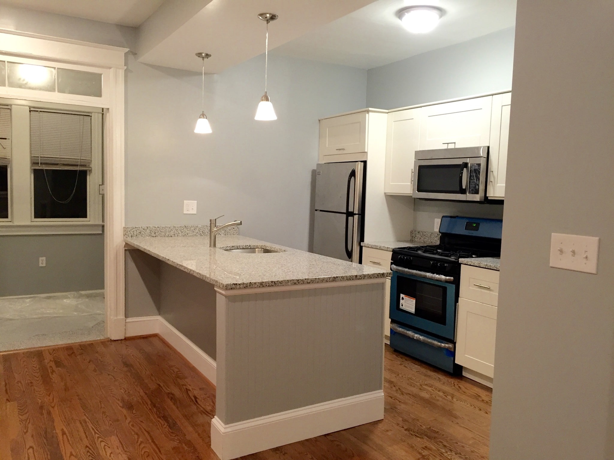 Kitchen with stainless appliances and large pantry closet. - 1110 4th St NE