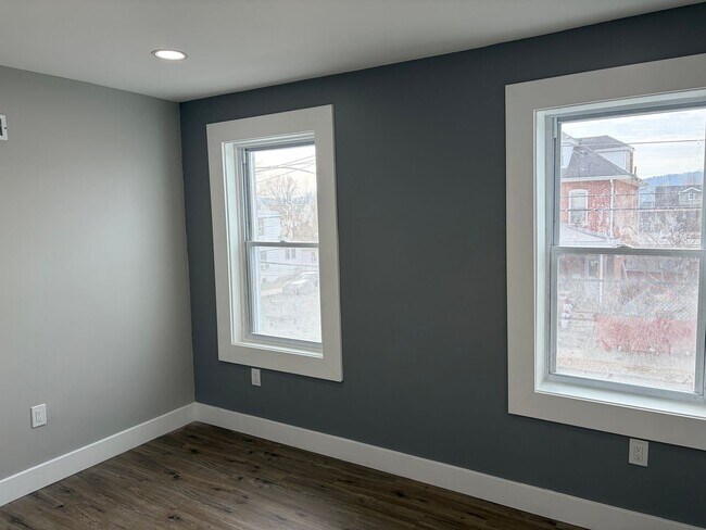 Building Photo - Newly Renovated 2- Story Townhome with Front Porch and Back Yard