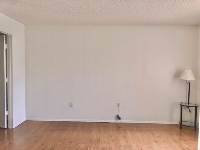 Building Photo - Nice 2X2 located on 2nd floor- Tile & lami...