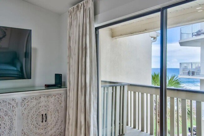 Building Photo - 50% off first months rent.  Gulf front com...
