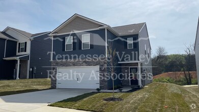 Building Photo - Enjoy the amenities in this  4 bedroom, 2....