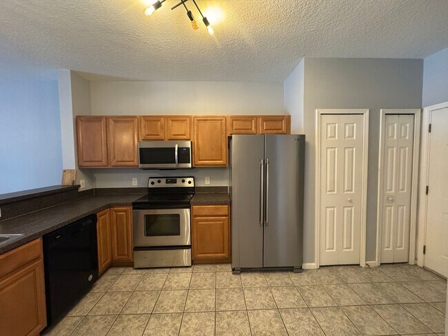 Building Photo - Available Now! Westside Timothy's Landing 2/2.5 Townhome with a 1-Car Garage