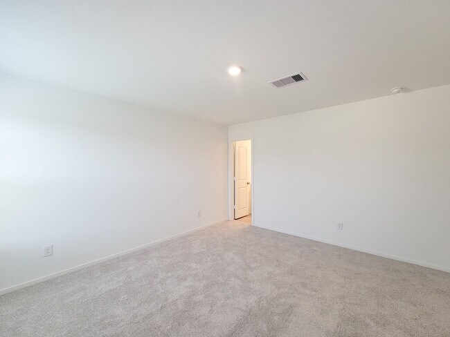 Building Photo - This single-level home showcases a spacious open floorplan shared between the kitchen, dining are...