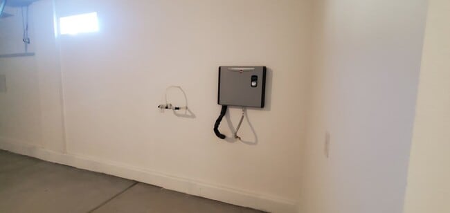 Building Photo - Beautifully designed modern townhome with attached garage.