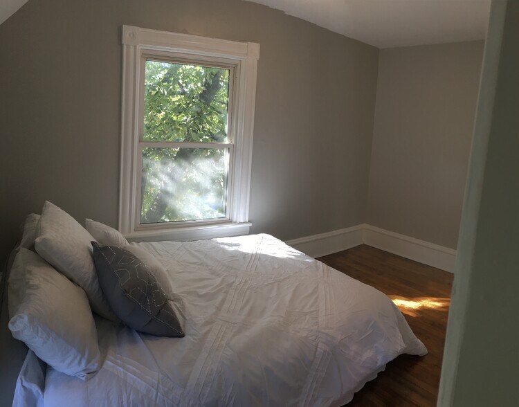 Bedroom 1 - Bright and enough room for queen bed and large dresser. - 1927 Washington Street Northeast
