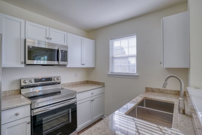 Building Photo - New, New, New - Spacious 3 Bedroom Townhouse with a Finished Basement !!