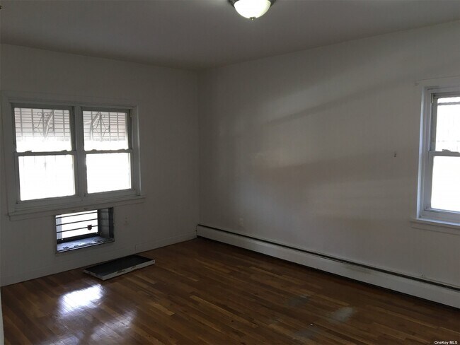 Building Photo - 43-18 Dahlia Ave