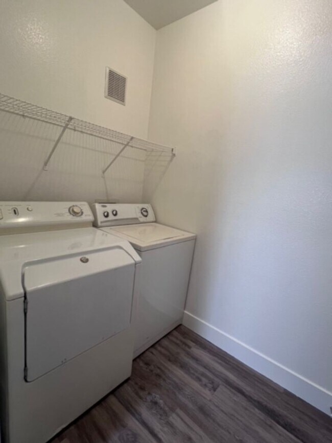 Building Photo - Three bedroom townhouse with 2 car garage