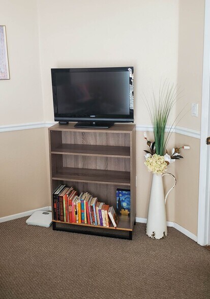 Book case with TV in bedroom - 115 112th Ave NE
