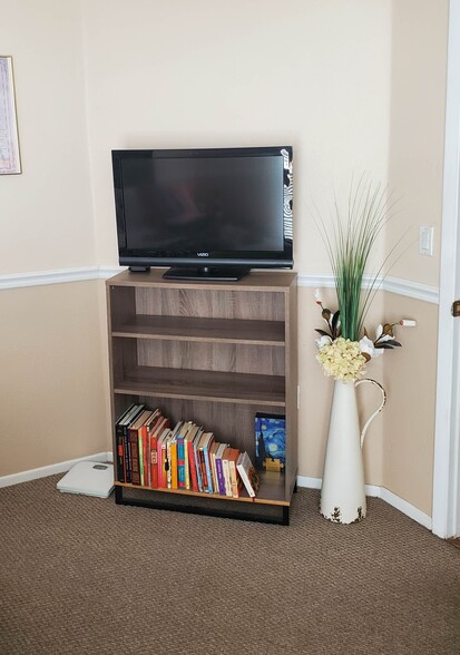 Book case with TV in bedroom - 115 112th Ave NE
