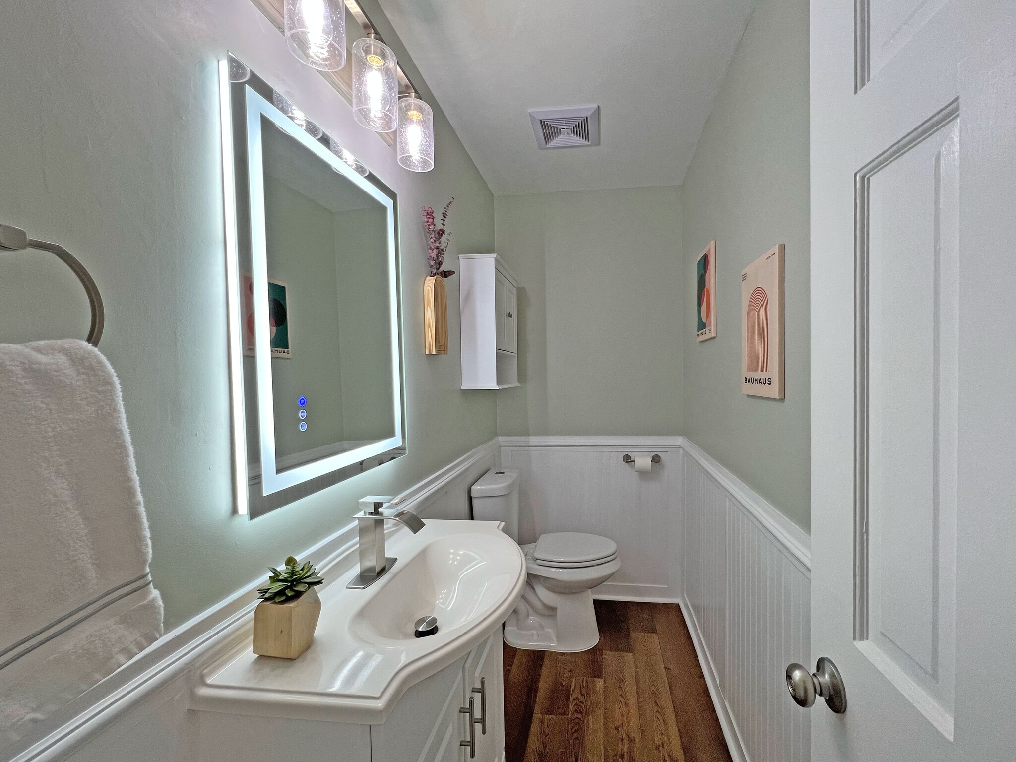 Large half bathroom featuring powered LED mirror - 160 17th Street Pl NW