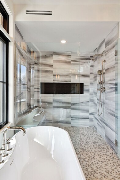Soak the stress of the day away in the large tub or the spacious shower with dual shower heads - 511 2nd St
