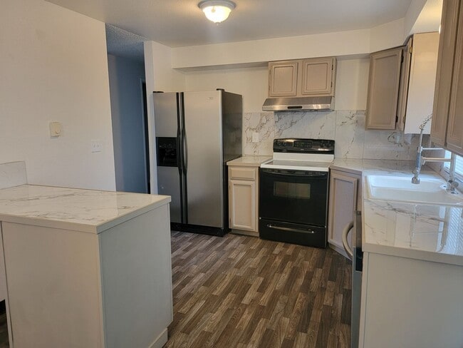 Building Photo - Spacious Spanaway rambler with covered patio and fenced yard.