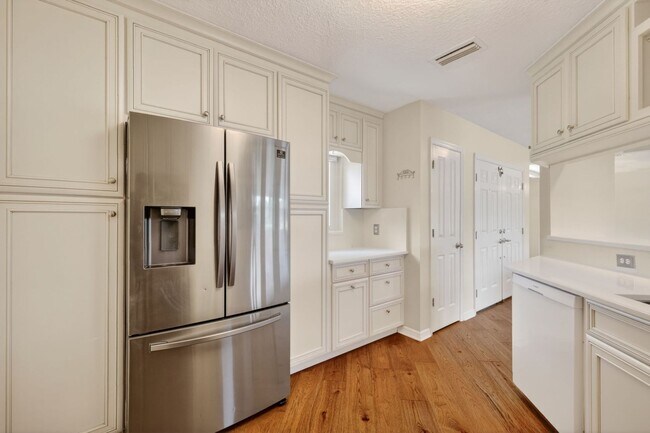 Building Photo - Available Now! Waterfront Living at Its Best – Pool, Decks & Gated Privacy