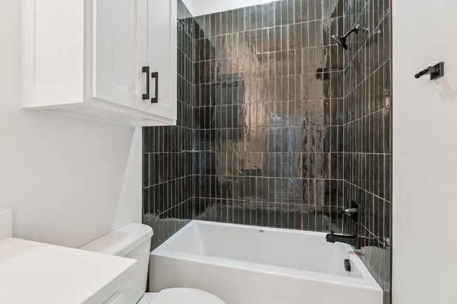 Building Photo - Minimalist Magic: 2-Bed Apartment Over Sel...