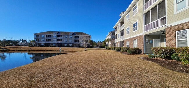 Building Photo - Stunning First-Floor, Fully Furnished Condo with Pond Views