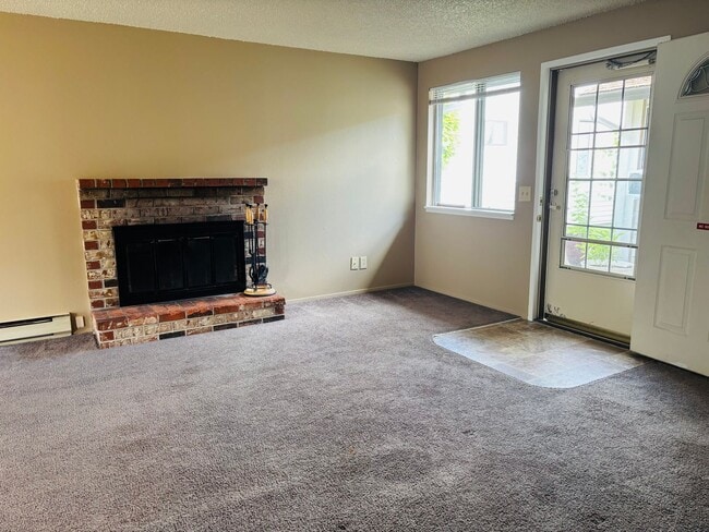 Building Photo - Bright 2 BR Carter Park Living with Fireplace, Carport, and Tons of Storage!