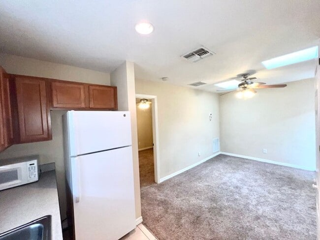 Building Photo - MOVE IN NOW-Water & electricity included 1x1 above garage apartment!! Full kitchen & bathroom!! W...