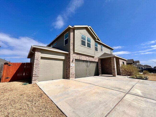 Building Photo - Spacious 4/BR 2.5/BA Two-Level Home with 3-Car Garage & Covered Deck