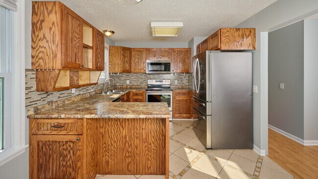 Building Photo - Now Ready : 4BR, 1 1/2BA home with fenced in back yard and storage building.