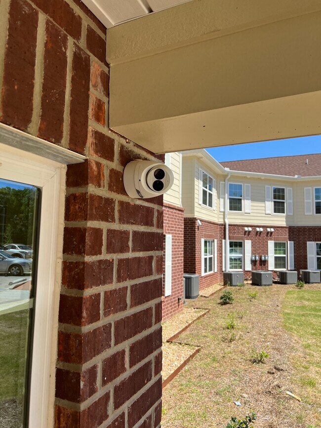 security cameras - 55+ Grimble Park Senior Apartment Community