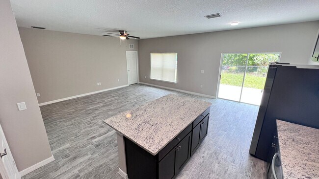 Building Photo - Spacious 3-Bedroom Home with Garage & Pati...