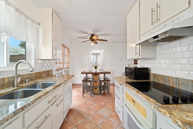 Kitchen view to dining table - 709 Agate St