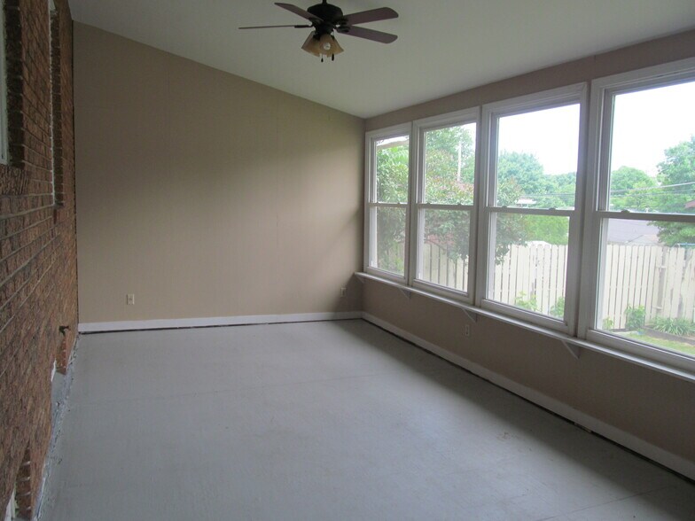 3 Seasons Porch with Bank of Windows Overlooking the Privacy Fenced Backyard - 2231 Hamilton St SW