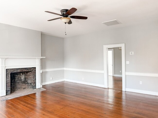 Building Photo - Renovated One-Bedroom Gem Steps from Train...