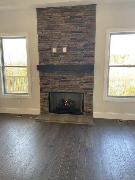 gas fireplace with stone - 1026 October Park Way