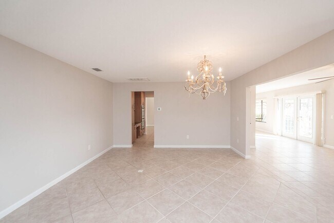 Building Photo - Welcome to this spacious three-bedroom, three-bath home in the heart of Palm Bay