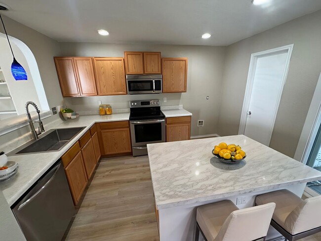 Building Photo - NEW PAINT, FLOORING, APPLIANCES & ROOF  | ...