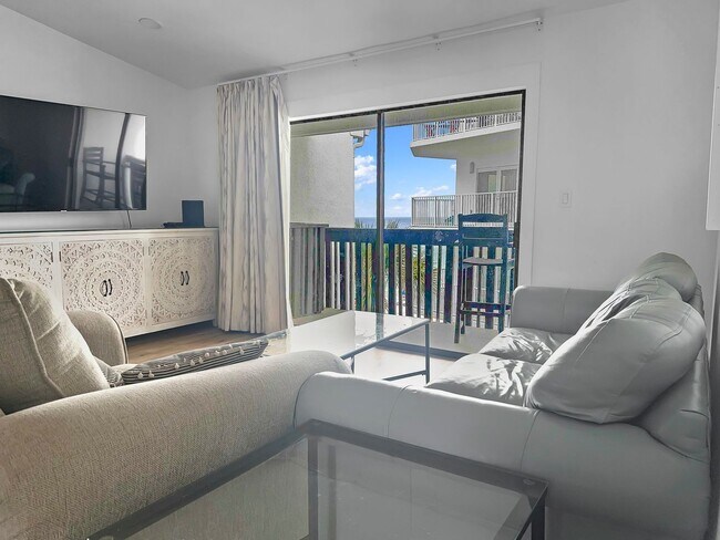 Building Photo - 50% off first months rent.  Gulf front com...