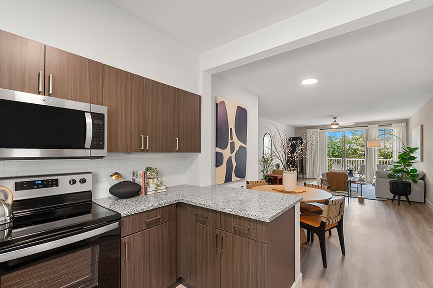 Beautifully upgraded kitchens with stainless steel appliances - The Timbers at Issaquah Ridge