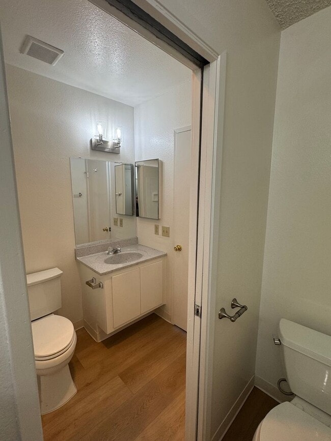 Building Photo - Upstairs two-bedroom 1/12 bath condo avail...