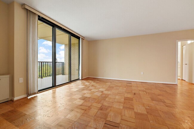 Building Photo - Spacious, and Sunlit 1 BD/1 BA Condo w/Reserved Garage Parking and Utilities Included in Chevy Ch...