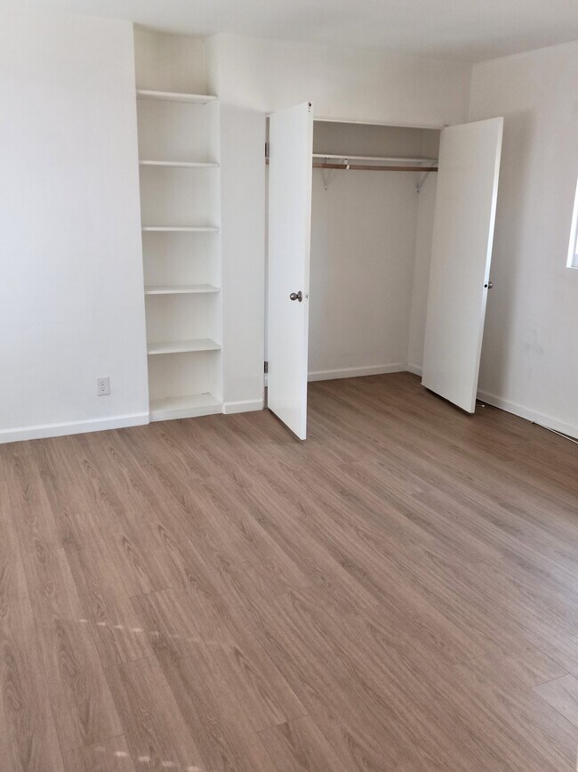 closet and shelves in main room - 1311 N Fairfax Ave