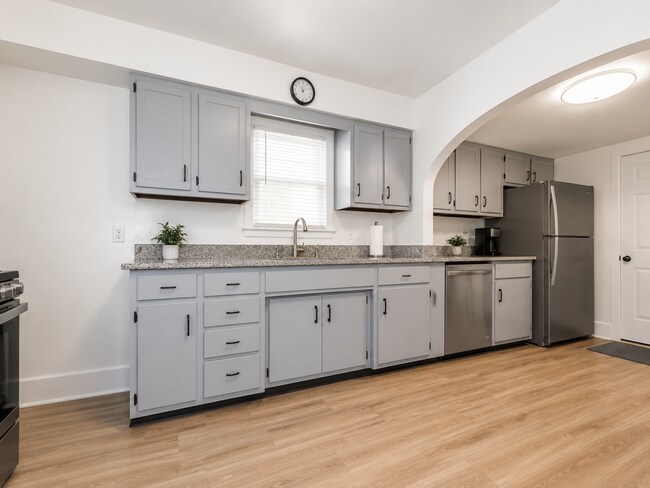 Building Photo - Charming 4BR Bungalow with Finished Basement & Fenced Yard