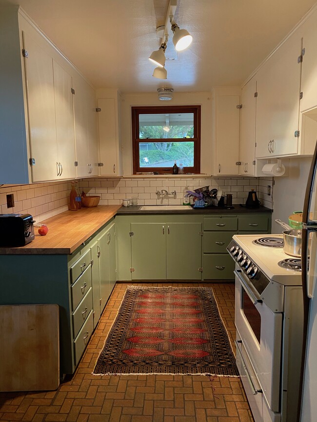 UPDATE OCT 19- just ordered upgraded stove and fridge, so all appliances will be white and fresh! Newly painted kitchen, new countertops, new lighting and lots of storage! Not shown in this pic is the washer/dryer unit, plus utility closet. - 340 NE Beyrl Ter