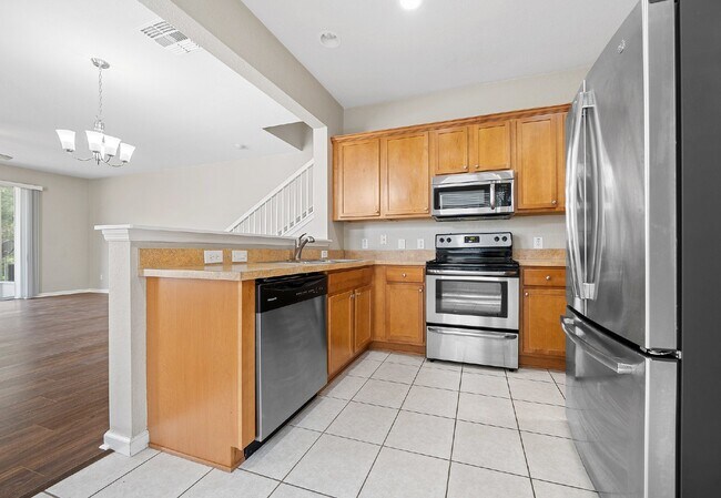 Building Photo - Corner Unit ~ Lake View ~ Maintenance Free...