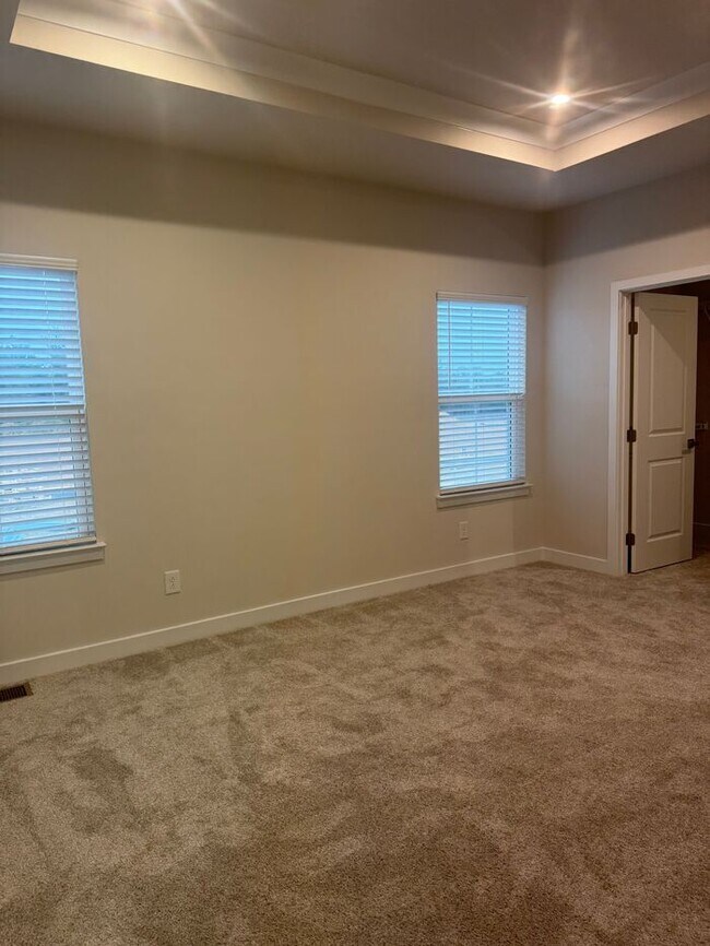 Building Photo - Brand New 3-Story Townhome with 2-Car Gara...