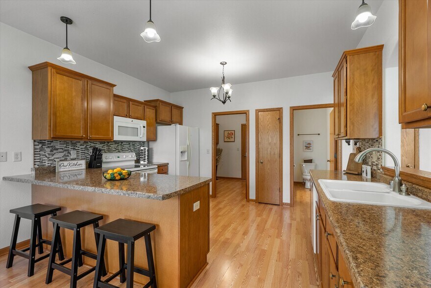 Half bath and laundry room leading to garage - 407 Century Oak Dr