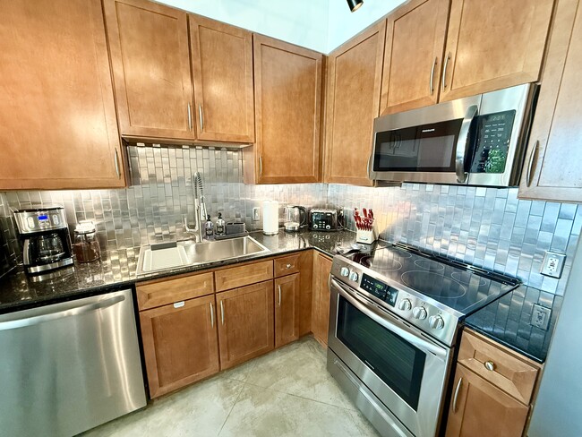 New coffee machine along with toaster, electric kettle, and knife block - 2001 Biscayne Blvd