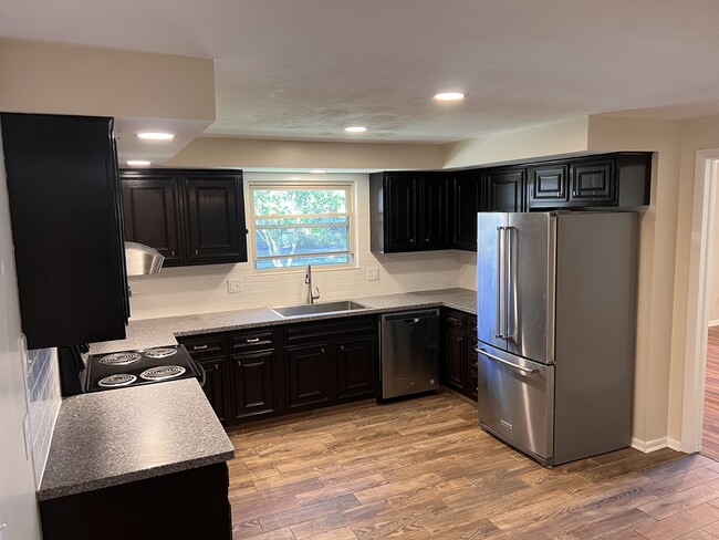 Kitchen with newer stainless steel appliances. - 1298 Cedarcliff Dr