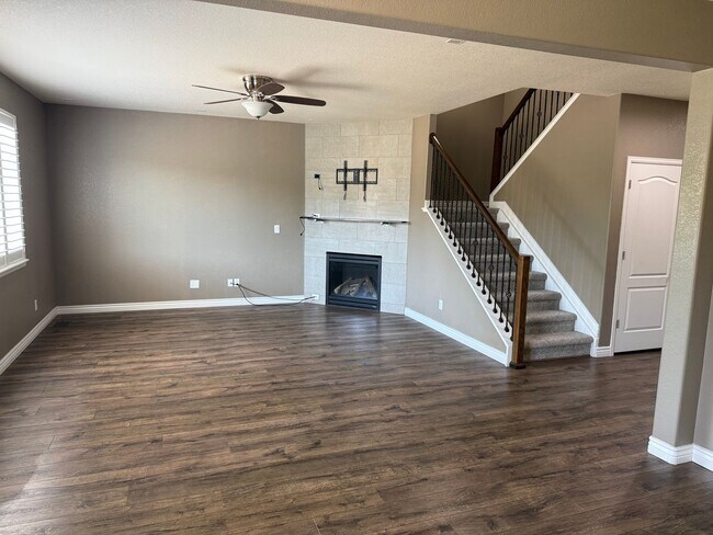 Building Photo - Greenbelt-Backed Wheatlands Home - Mountain Views, 3 Car Garage & Finished Basement
