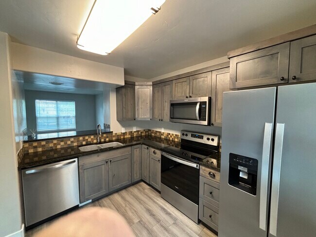 Kitchen with view into Front Living Room - 363 Royal Troon Dr