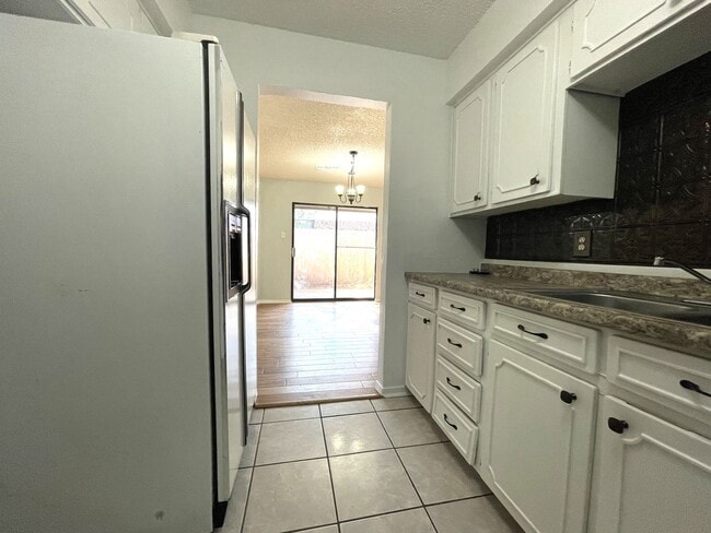Building Photo - Spacious Snyder Home: 3 Beds, 2 Baths, 2-Car Garage & Cozy Carpeted Bedrooms!