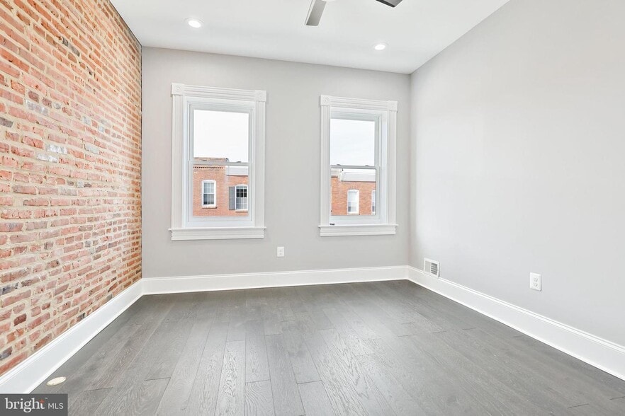 Medium Bedroom showing the windows and high ceilings and ceiling fan (1 of 2) - 263 S Robinson St