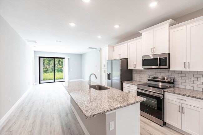 Building Photo - Brand New 4-Bedroom Gem with 2 Full Baths on Large Lot in Lehigh Acres – A Perfect Family Haven!